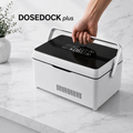 DoseDock Plus peptide and insulin travel cooler with carry handle, black touchscreen control panel showing 6°C, white compact body on marble surface